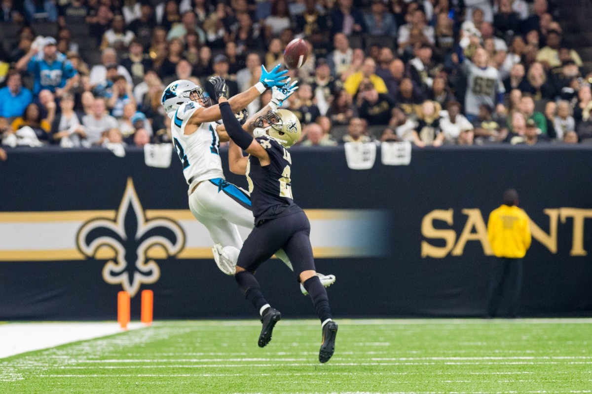 Saints corner back Marshon Lattimore breaks up a pass to Panthers receiver DJ Moore. SCOTT CLAUSE/USA TODAY Network